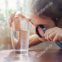 child-examining-water