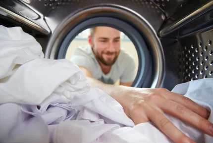 Man using a washing machine