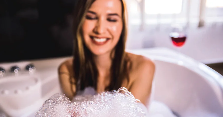 Woman enjoying a soft water bath with lots of bubbles