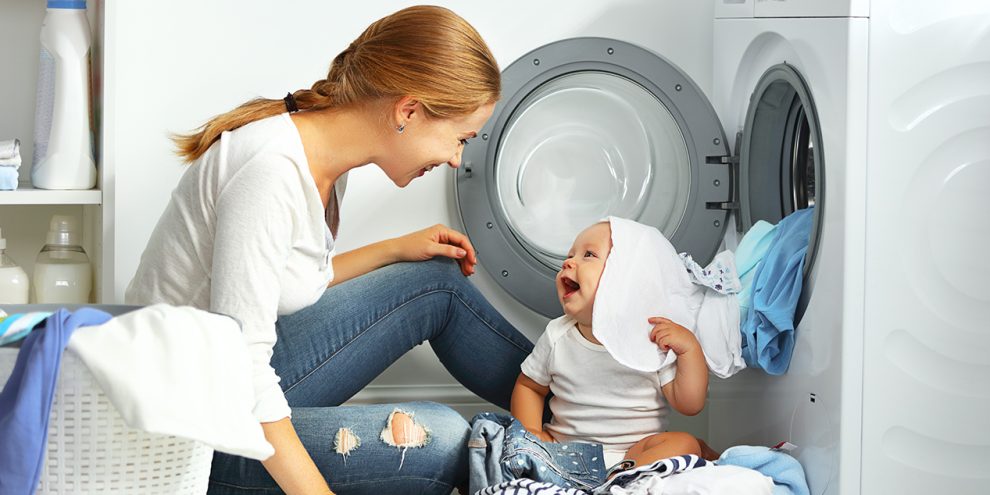 mum and baby doing laundry