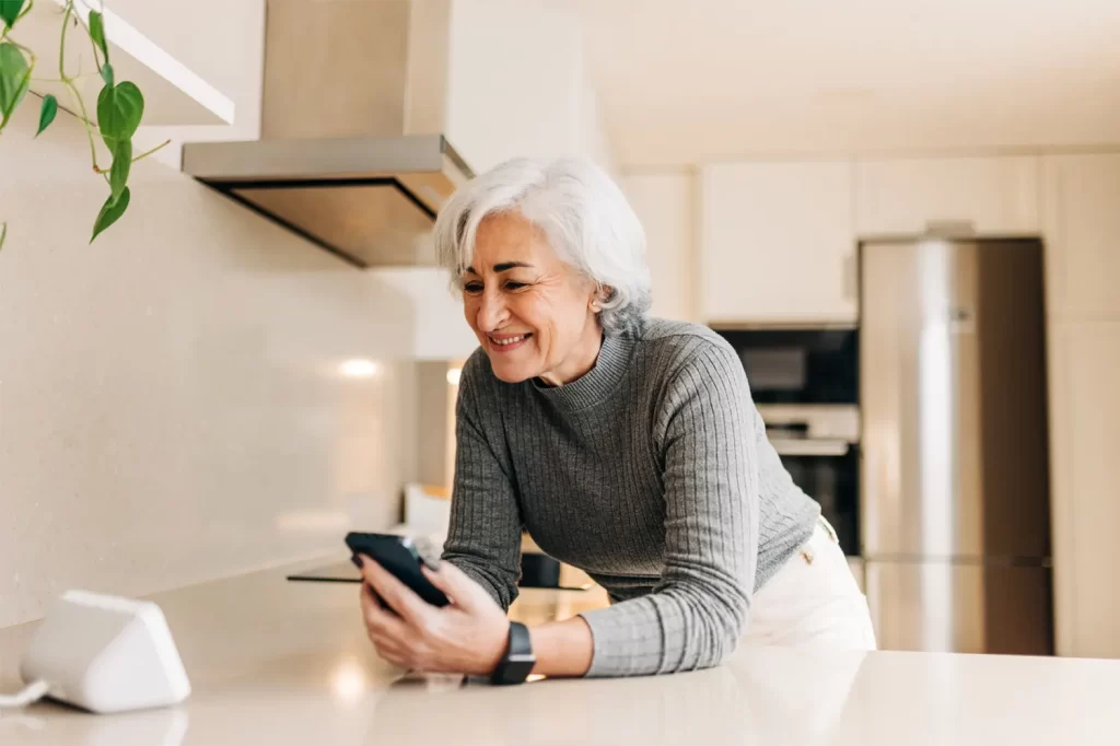 woman-on-phone-infront-of-smartspeaker