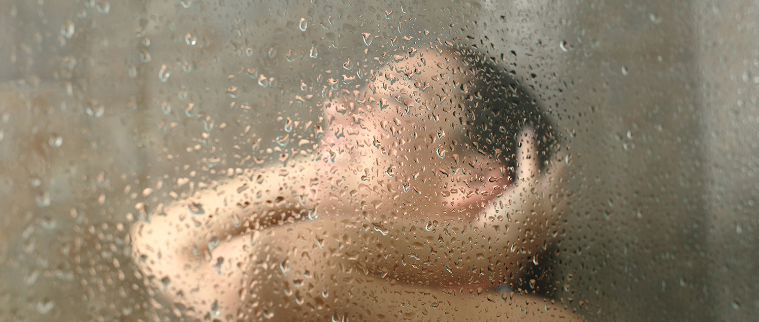 woman washing hair shower